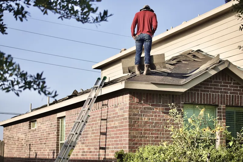 Professional roofer working on a residential roof in Chesapeake Ranch Estates